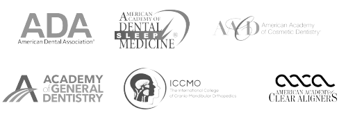 Logos of professional dental organizations, indicating clinic affiliations and certifications.
