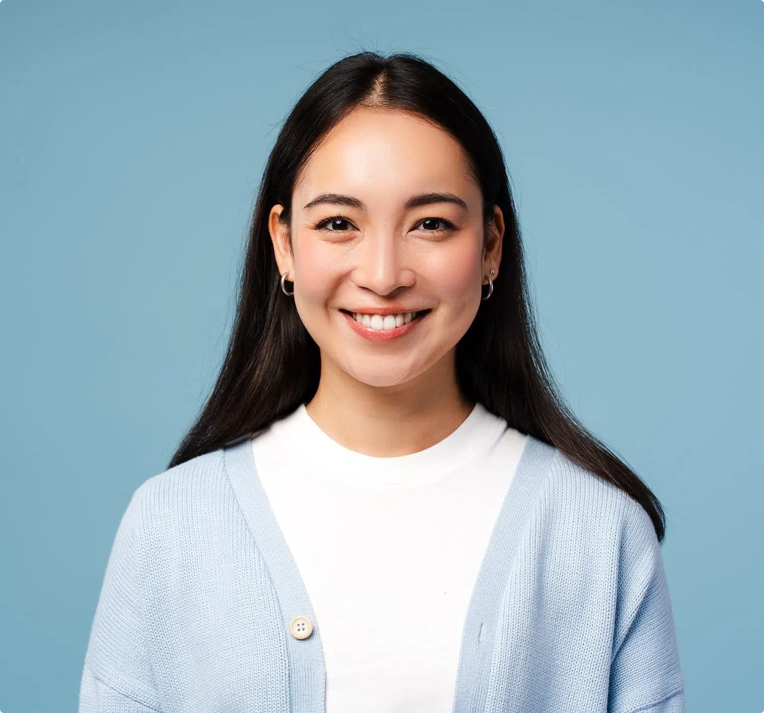 Woman smiling confidently, showcasing clean and healthy teeth for dental promotion.