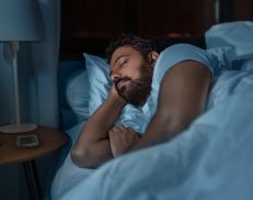 A man sleeping soundly in bed